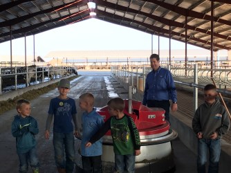 Boys showing the push feed robot